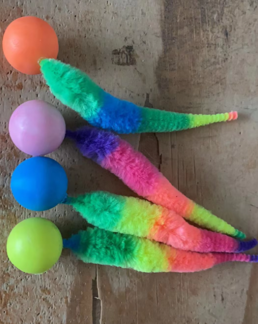 Stimulating interactive cat toy with a charming plush tail and a classic play ball.