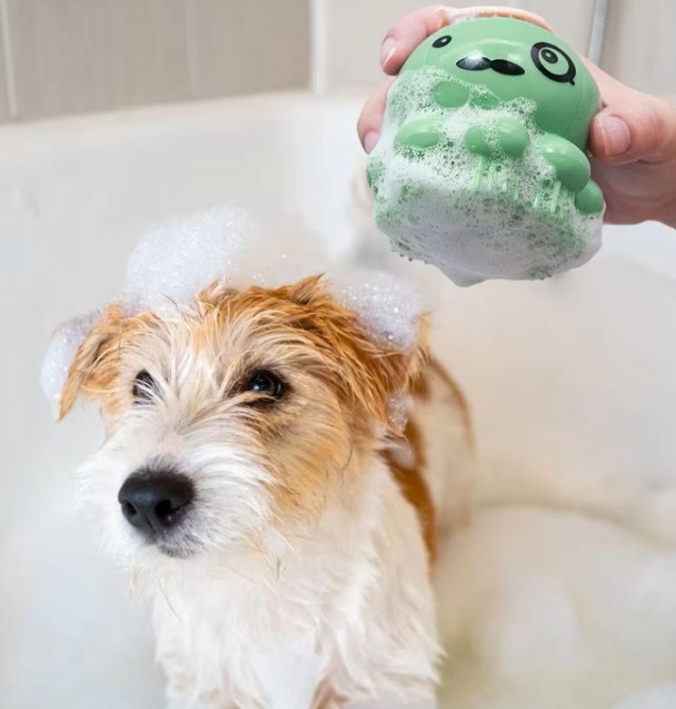 Pet grooming brush with built-in foam dispenser for easy dog & cat bathing and gentle massage.