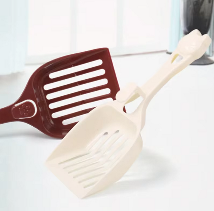 Stylish cat head litter scoop, a durable cleaning tool for easy and hygienic cat litter box maintenance.