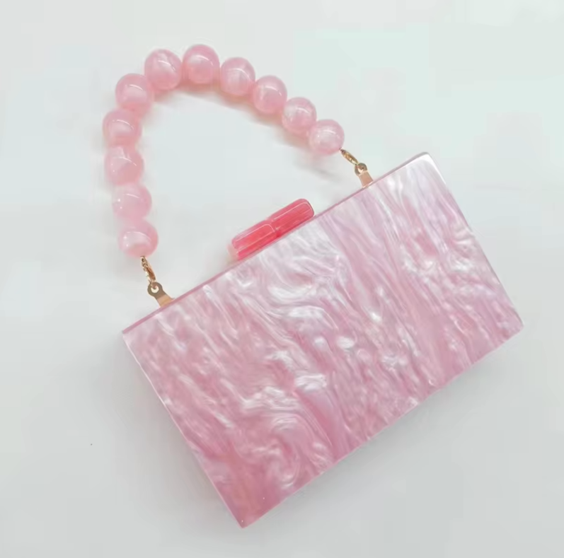 Chic women's acrylic handbag, old money style clutch for glamorous party outfits.