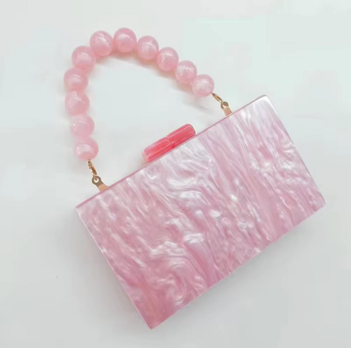 Chic women's acrylic handbag, old money style clutch for glamorous party outfits.