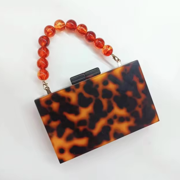 Must-have women's acrylic clutch, elegant old money style accessory for evening parties.