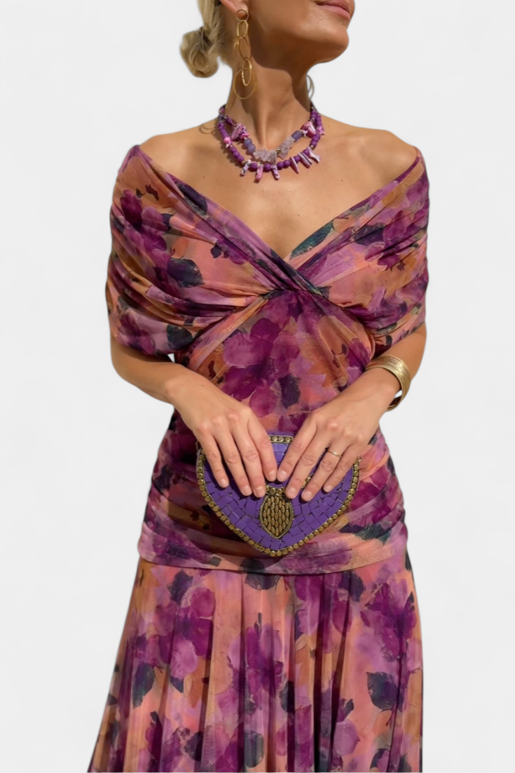 Elegant women's V-neck floral maxi dress, featuring a pleated waist and flowy silhouette.