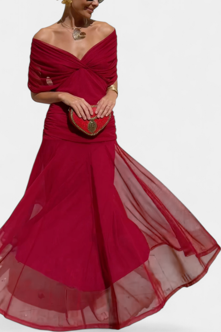 Women's formal wedding guest dress. Sophisticated drape design, ideal for special occasions.