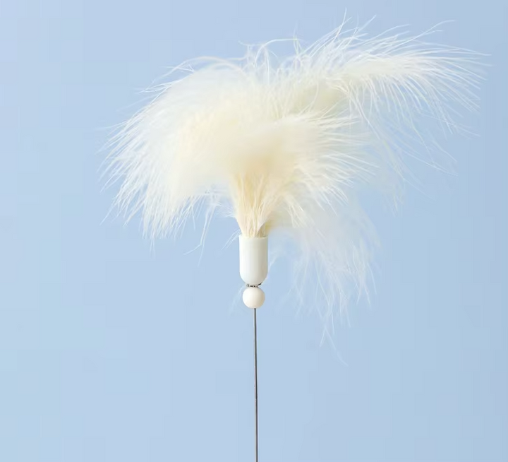 Vibrant interactive cat toy with a bright feather and a track for a rolling ball, stimulating feline fun.