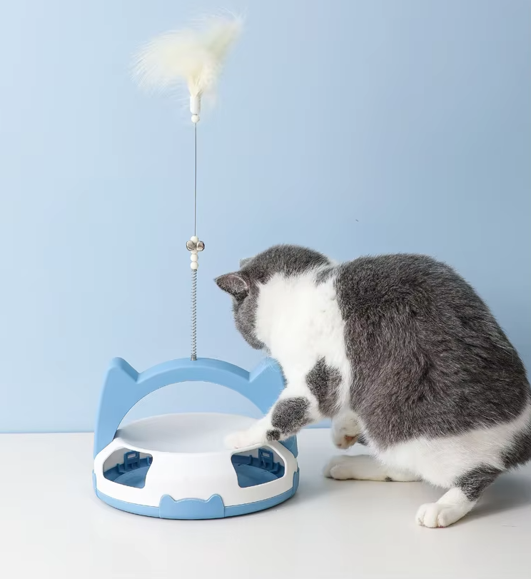 Interactive cat toy with a rolling ball track & a stimulating feather, promoting active play for pets.