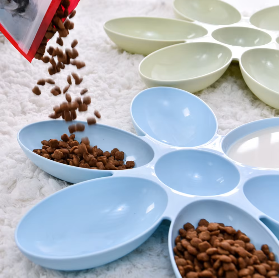 Multi-cat feeding station with 6 colorful flower-petal bowls, perfect for multiple pets.