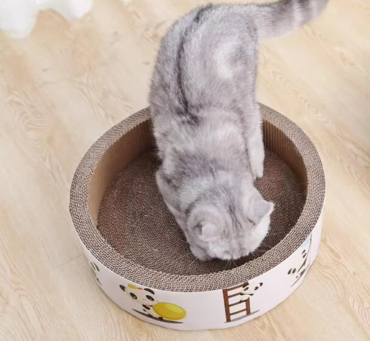 Durable round cardboard cat scratcher to protect furniture from pet claw damage.