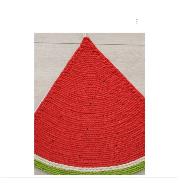 Vibrant fruit-shaped cat scratch mat. Durable sisal surface for claw care, a fun pet toy.