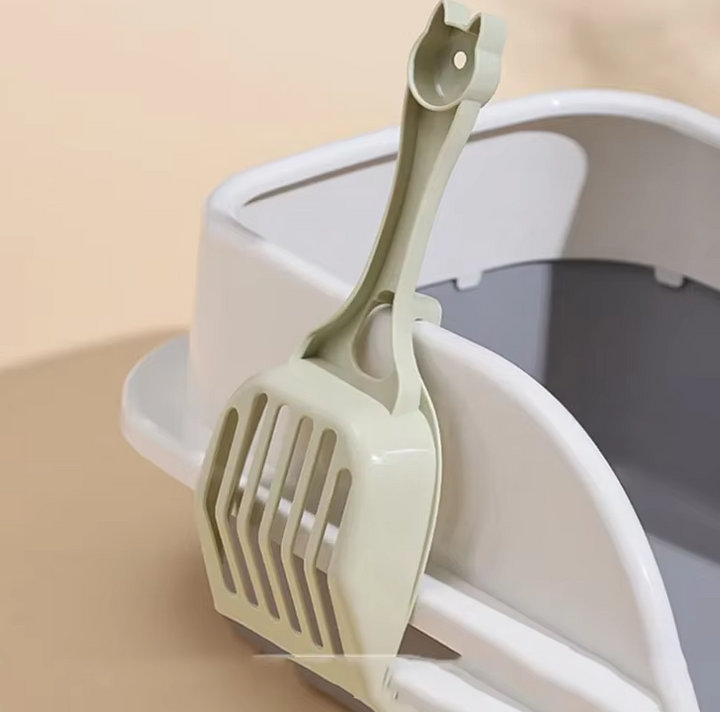 Pet accessory: Cat head design litter scoop for quick and hygienic cleanup of cat waste in the litter box.