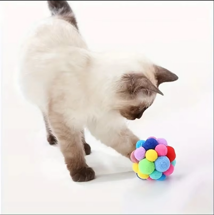 Bright pompom cat toy ball, soft & durable, ideal for interactive play and feline enrichment.