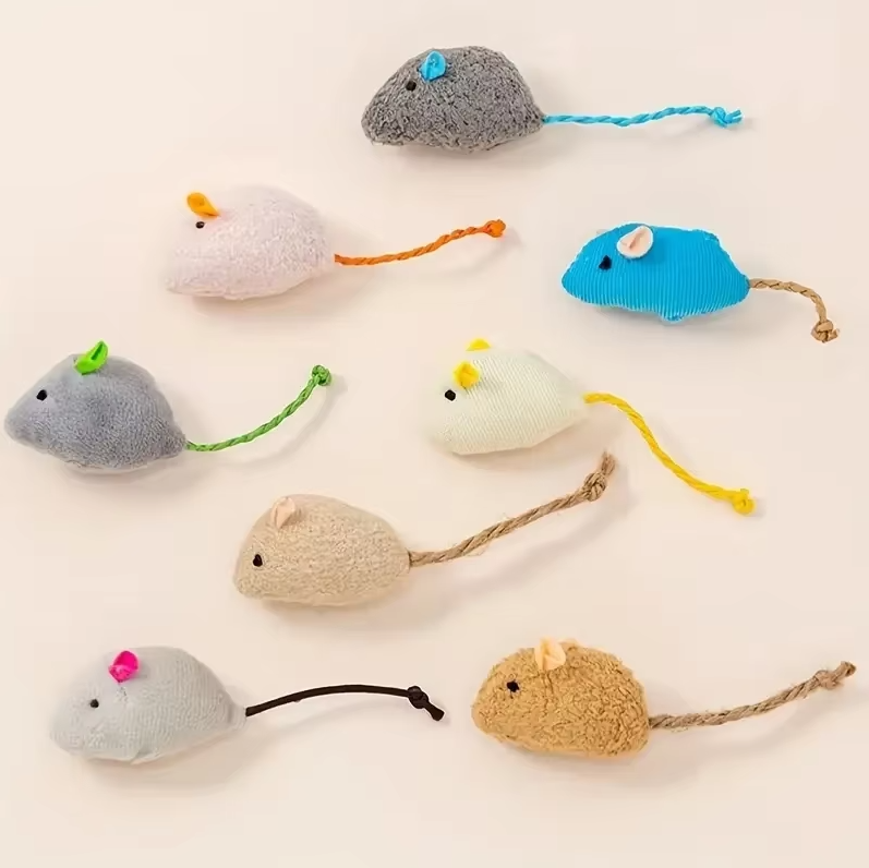 Close-up of 3 grey plush mice cat toys, perfect soft prey for interactive feline enrichment & fun.