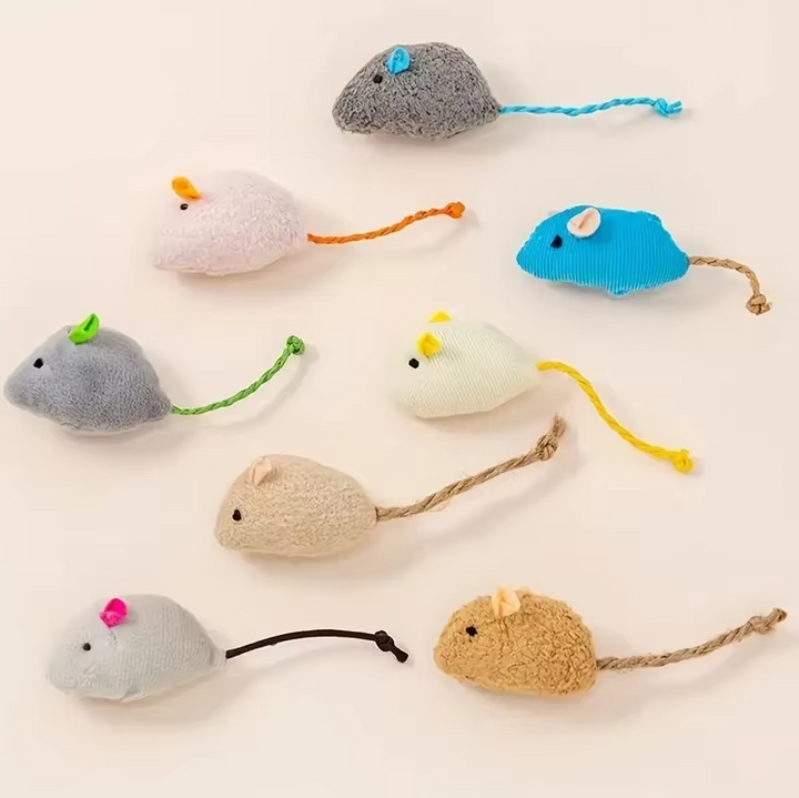 Close-up of 3 grey plush mice cat toys, perfect soft prey for interactive feline enrichment & fun.