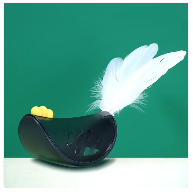 Close-up of an interactive cat feather toy with treat dispensing slots, designed for playful enrichment.