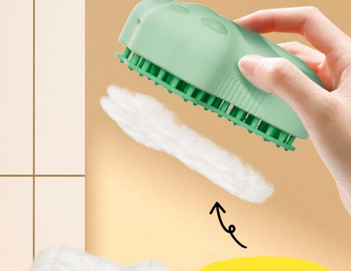 Ergonomic electric cat grooming brush with soap tank for bathing and gentle massage.