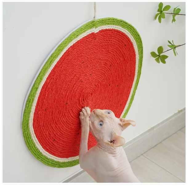 Cute strawberry cat scratch mat. Sisal surface protects furniture, provides endless feline fun.