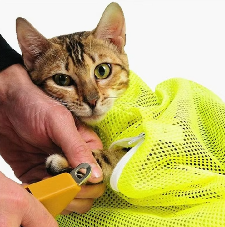 Cat's mesh grooming bag for stress-free bathing, nail trimming, and pet care.