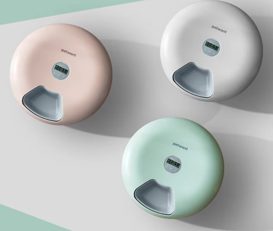 Modern pet bowl and food dispenser with digital controls for scheduled, mess-free feeding.