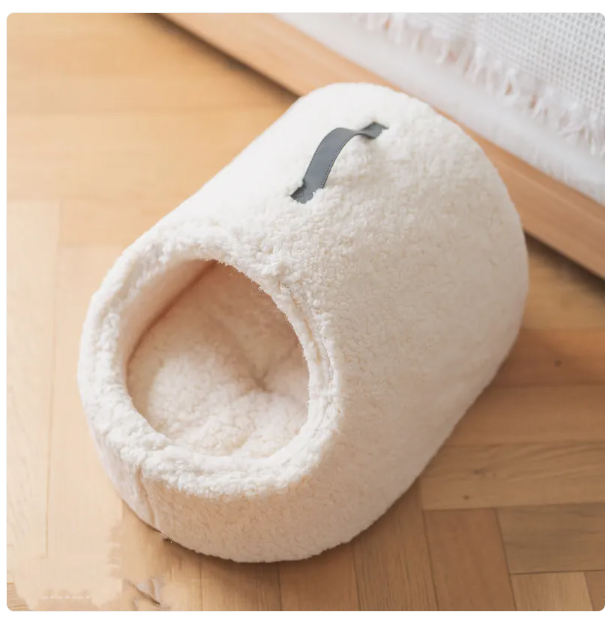 Spacious cozy cat house bed with a fluffy edge, ideal for pet comfort and a relaxing feline retreat.