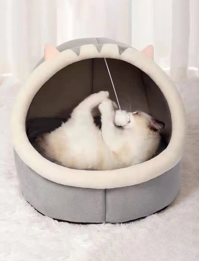 Unisex cat bed & pet cave, featuring a soft plush igloo shape, adorable ears & an engaging play ball.