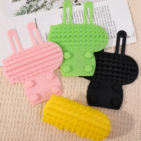 Multi-color silicone cat scratching brush for itch relief & grooming. Essential cat care accessory.