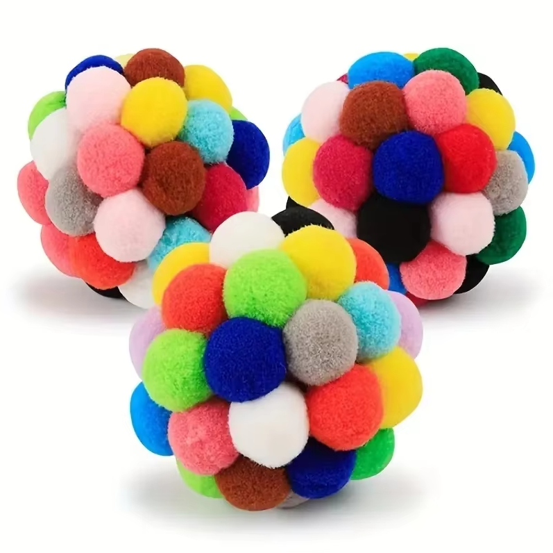 Interactive cat toy: soft, colorful pompom ball, perfect for playful kittens and house cat fun.