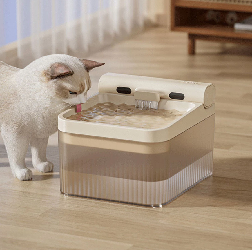 Pet water fountain with running flow & triple filter for cats & dogs, ensuring fresh hydration.
