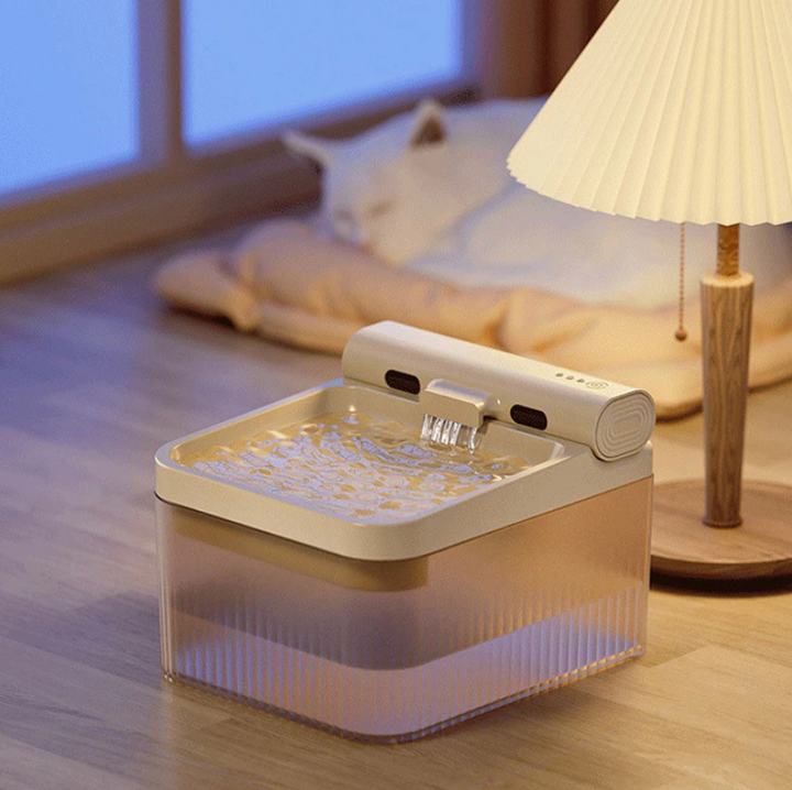 Modern pet fountain providing fresh, triple-filtered water for cats, dogs, & small pets.