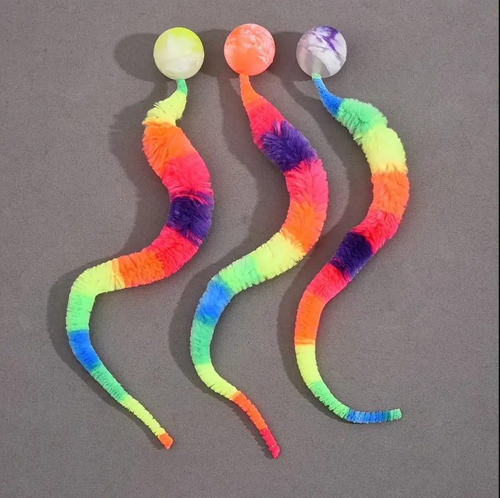 Engaging interactive cat toy featuring a plush tail and a dangling ball for indoor cats.