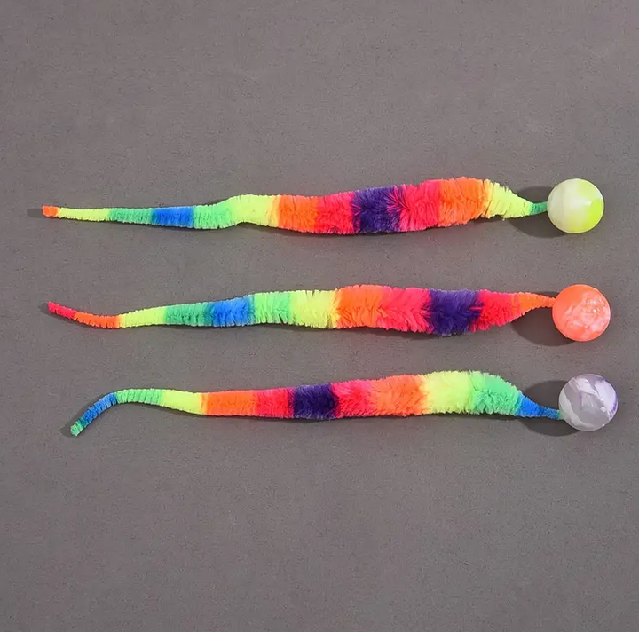 Playful interactive cat toy with a fluffy tail and sturdy ball, promoting pet play.