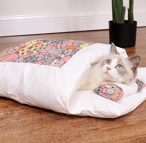 Washable cat sleeping bag, a warm & cozy pet bed for indoor cats. Essential cat supplies for comfort.