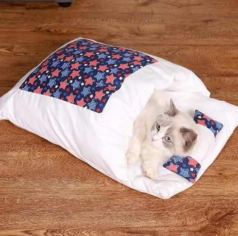 Indoor cat sleeping bag, a cozy and warm pet bed. Washable for easy care. Essential cat supplies.