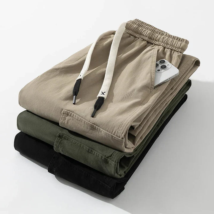 All-season men's wide leg cargo trousers, casual style with drawstring waist and functional flap pockets.