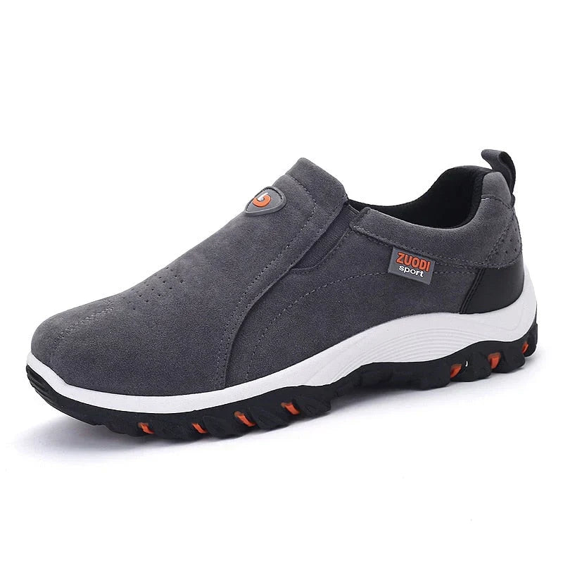 Stylish gray men's slip-on sneakers, designed for everyday comfort, athletic support, and versatile wear.