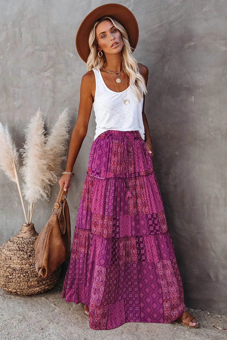 High-waisted A-line maxi skirt for women, featuring a beautiful floral print & elegant drape.