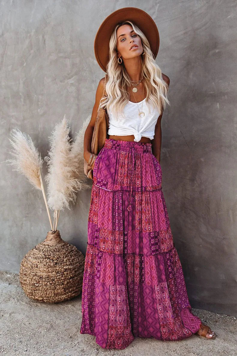Flowy high-waisted floral maxi skirt, A-line cut, perfect for women's casual or elegant looks.