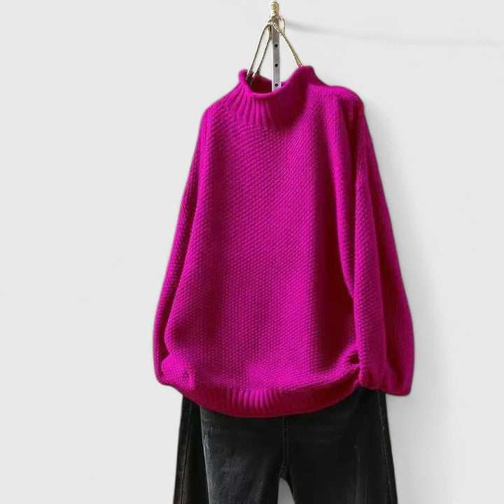 Woman in a cozy textured mock neck jumper enjoying fall weather, stylish long sleeve sweater for outdoors.