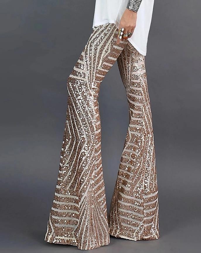 Women's sparkling glitter flare pants, ideal for glamorous party wear or evening fashion. Mid-rise statement bottoms.
