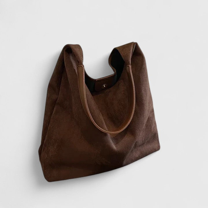 Modern women's tote bag, a functional and stylish everyday handbag. Spacious interior for essentials.