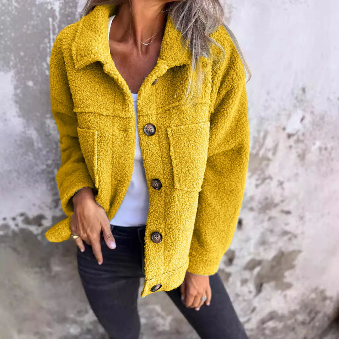 Women's short spring jacket, stylish design with cuffed sleeves. Lightweight, casual, & fashion-forward outerwear.