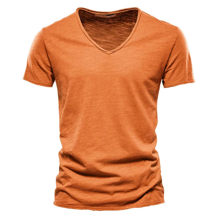 Relaxed fit men's V-neck summer shirt with short sleeves. Offers breathable comfort and casual style for warm days.