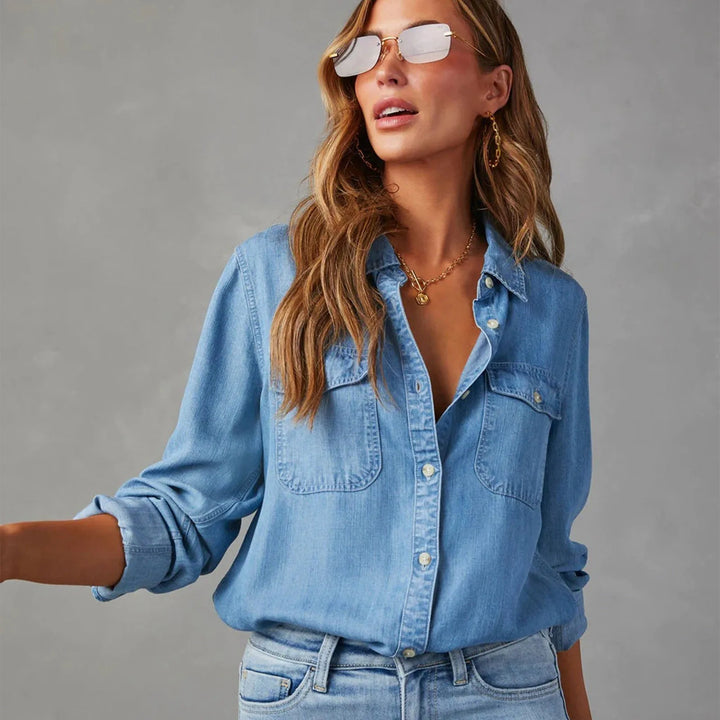 Elegant light blue women's button-up shirt. A comfortable, long-sleeve top for casual yet chic everyday wear.