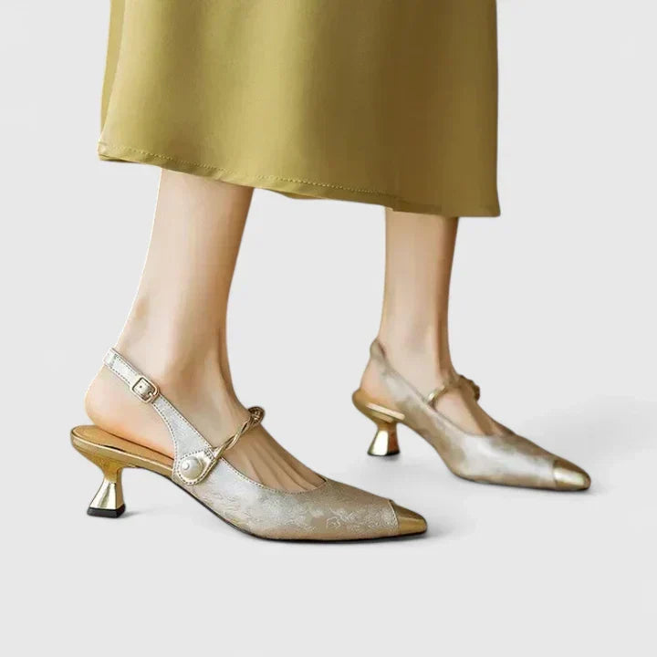 Women's elegant orthopaedic kitten heels featuring a distinctive pearl strap and comfortable design.