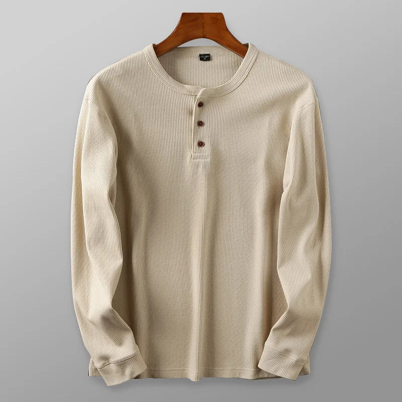 Men's minimalist waffle henley shirt, breathable long sleeve top for comfortable everyday wear.