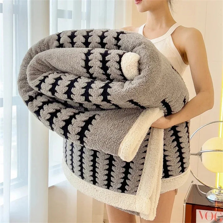 Modern geometric reversible throw blanket. Soft sherpa & warm, a stylish home decor piece.
