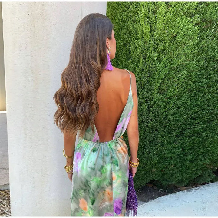 Vibrant tie-dye halter maxi dress for women, featuring a boho-chic style & removable bow, ideal for summer vacation wear.