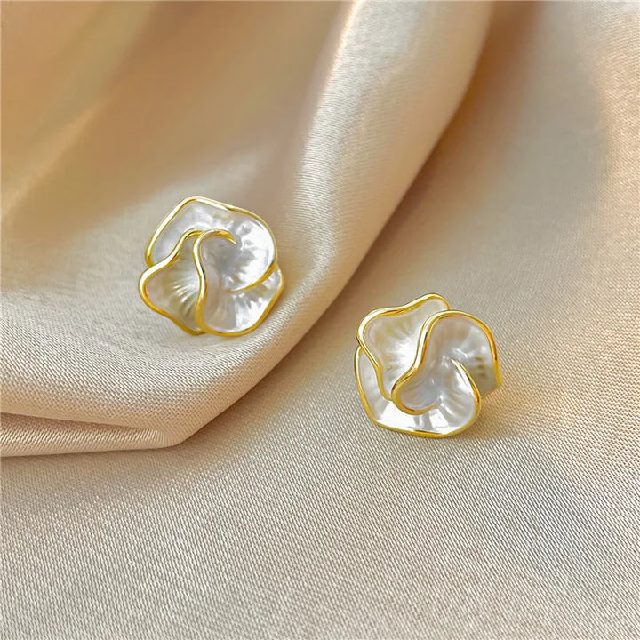 Stunning women's pearl flower drop earrings with intricate floral design. Stylish & sophisticated.