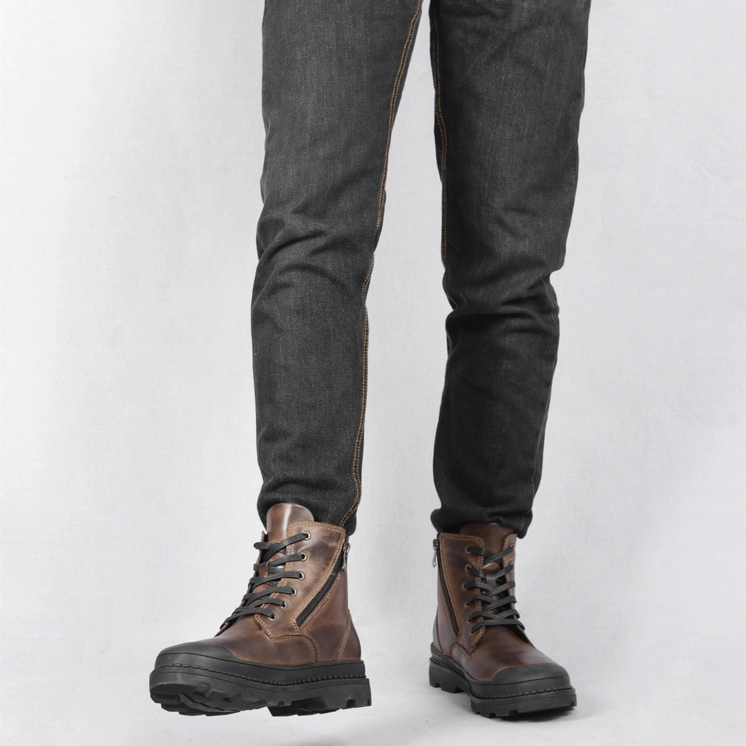 Sturdy and durable men's vintage leather combat boots with reliable lace and zip closures. Rugged winter footwear.