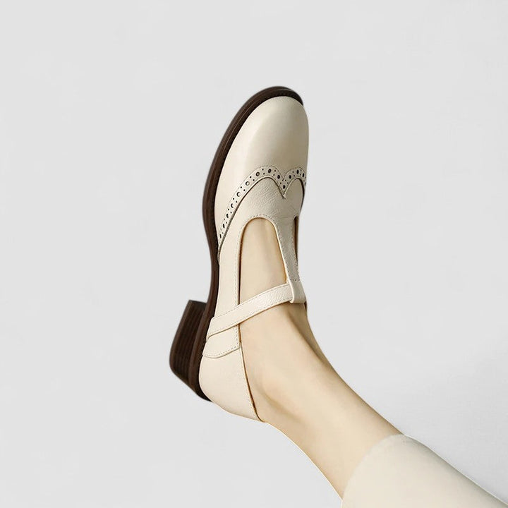 Black classic women's Mary Jane shoes, comfortable flats with an instep strap for everyday style.