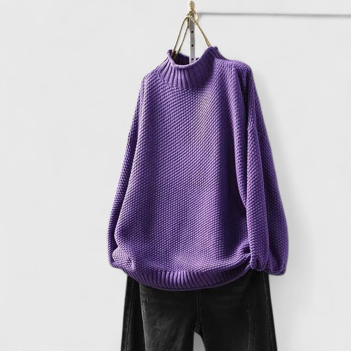 Woman models a cozy textured knit mock neck jumper, styled for chic casual fall & winter fashion.